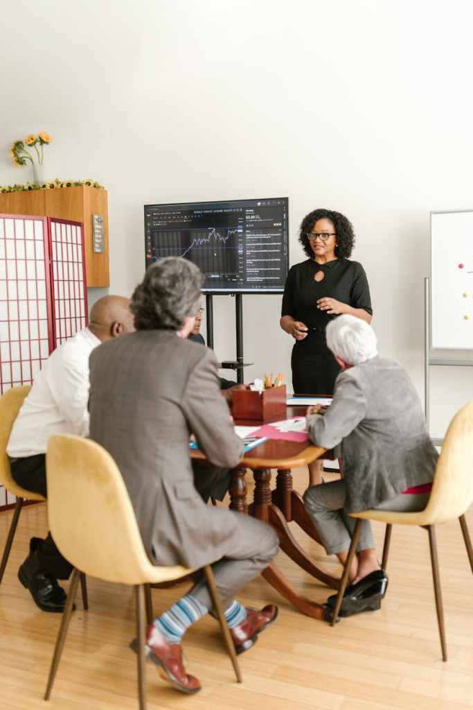 woman presenting in front of people